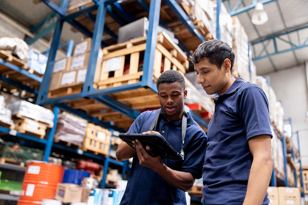 Two workers in a warehouse